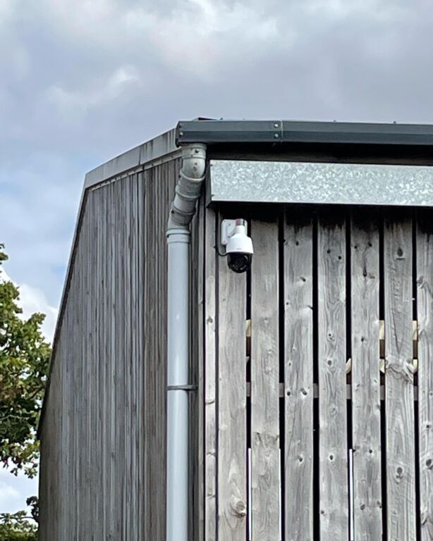 CCTV camera for rural security systems installed beneath a timber farm building roof