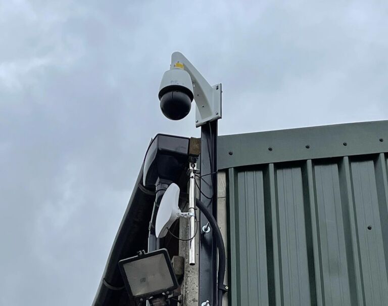 CCTV camera and monitoring equipment for rural security systems mounted beside a farm building