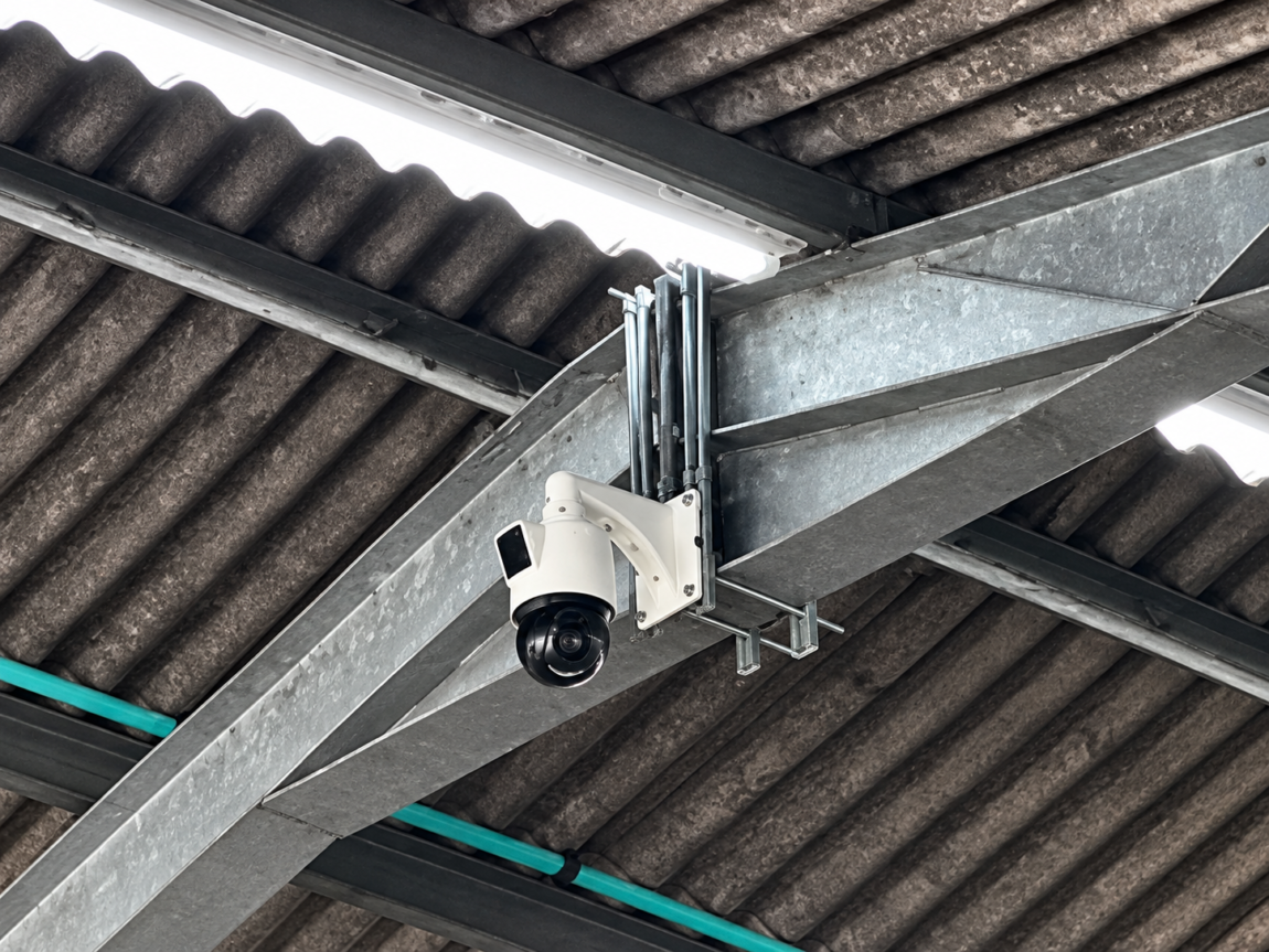Farm CCTV systems: dome camera fixed to a steel beam inside an agricultural building
